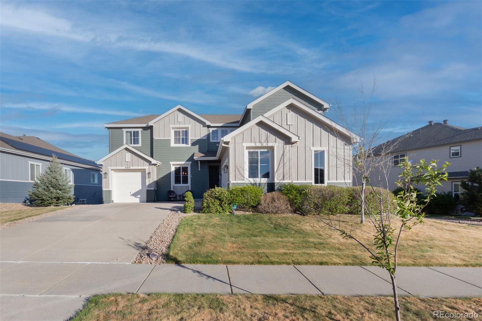 8474 Poppy Street Arvada, CO 80007 - Photo 40 of 40 a front view of a house with a yard