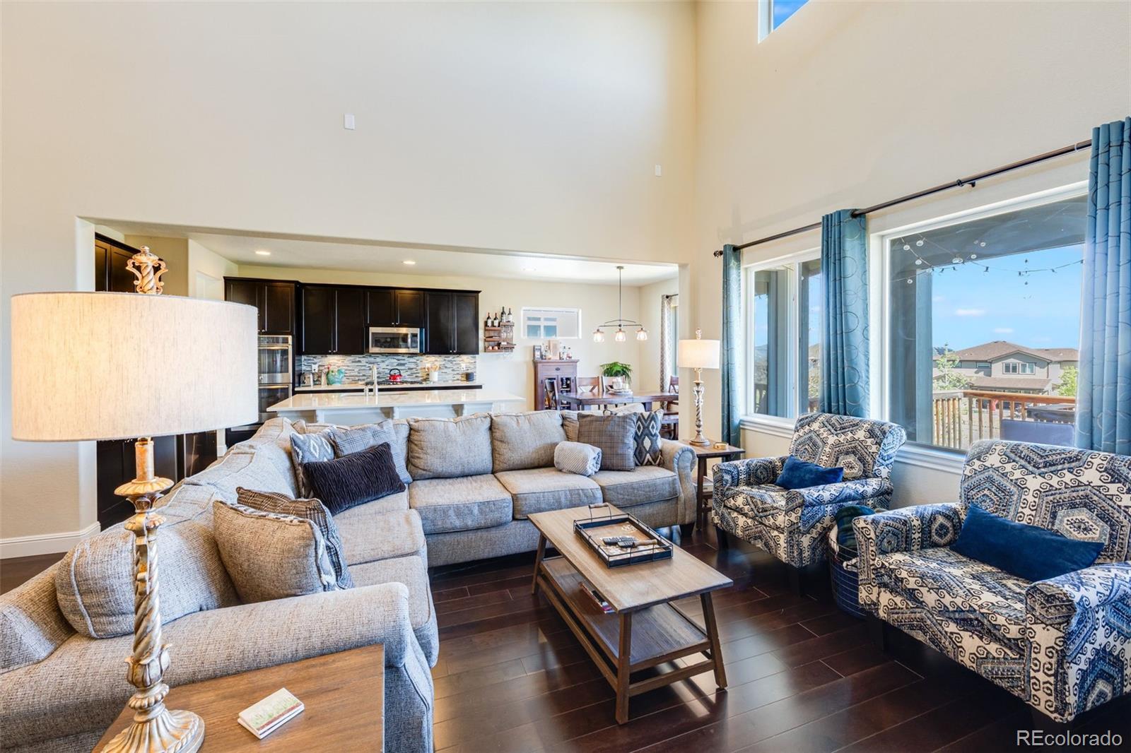 8474 Poppy Street Arvada, CO 80007 - Photo 5 of 40 a living room with furniture and a large window