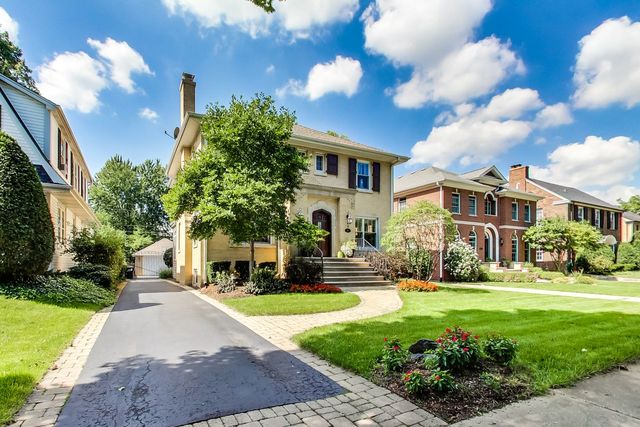 416 Wisner Street Park Ridge, IL 60068 - Photo 2 of 49 a front view of a house with garden and trees