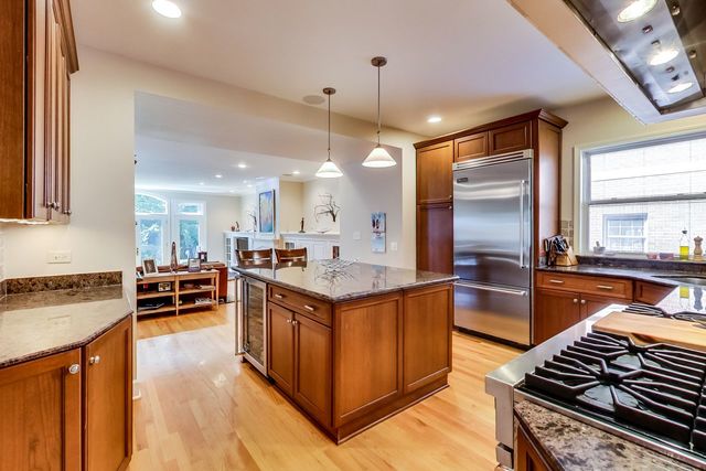416 Wisner Street Park Ridge, IL 60068 - Photo 12 of 49 a kitchen with kitchen island a stove a sink a oven and refrigerator
