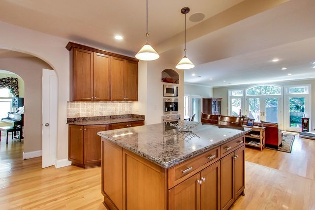 416 Wisner Street Park Ridge, IL 60068 - Photo 13 of 49 a kitchen with stainless steel appliances granite countertop a sink a stove and a wooden floors