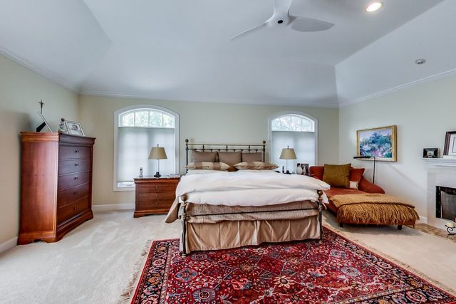 416 Wisner Street Park Ridge, IL 60068 - Photo 25 of 49 a bedroom with a bed and a chandelier