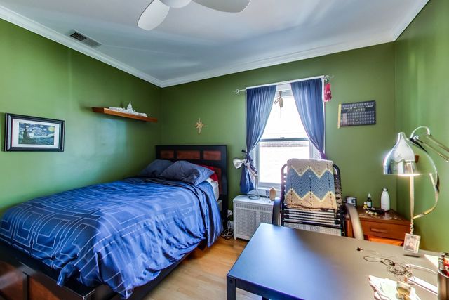 416 Wisner Street Park Ridge, IL 60068 - Photo 32 of 49 a bedroom with a bed and window