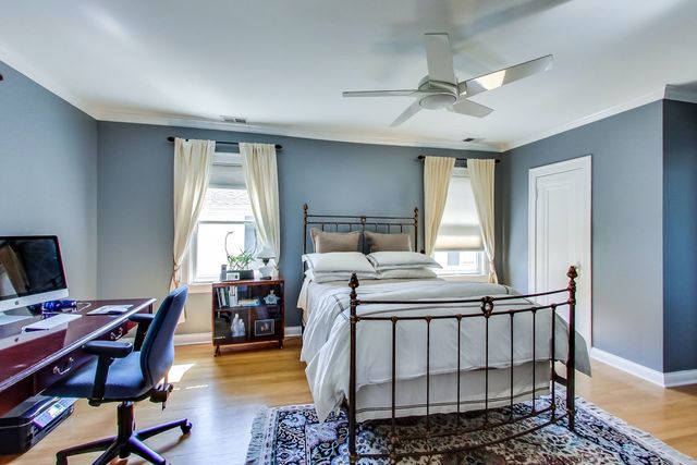 416 Wisner Street Park Ridge, IL 60068 - Photo 35 of 49 a bedroom with a bed a table and chair