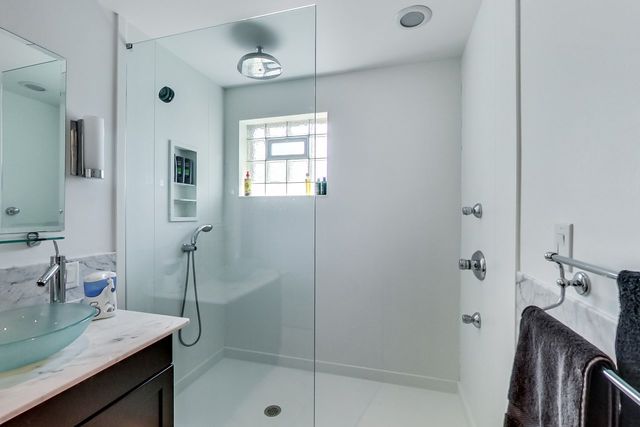 416 Wisner Street Park Ridge, IL 60068 - Photo 37 of 49 a bathroom with a shower sink and mirror