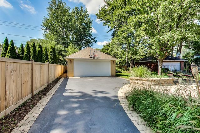 416 Wisner Street Park Ridge, IL 60068 - Photo 45 of 49 a front view of a house with a yard and trees