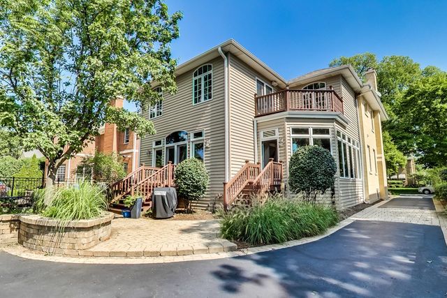 416 Wisner Street Park Ridge, IL 60068 - Photo 48 of 49 a front view of a house with a yard and potted plants