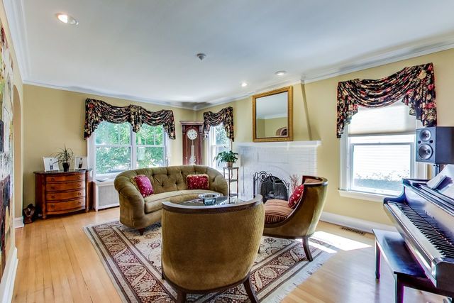 416 Wisner Street Park Ridge, IL 60068 - Photo 7 of 49 a living room with furniture and a fireplace