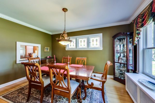 416 Wisner Street Park Ridge, IL 60068 - Photo 10 of 49 a view of a dining room with furniture window and wooden floor