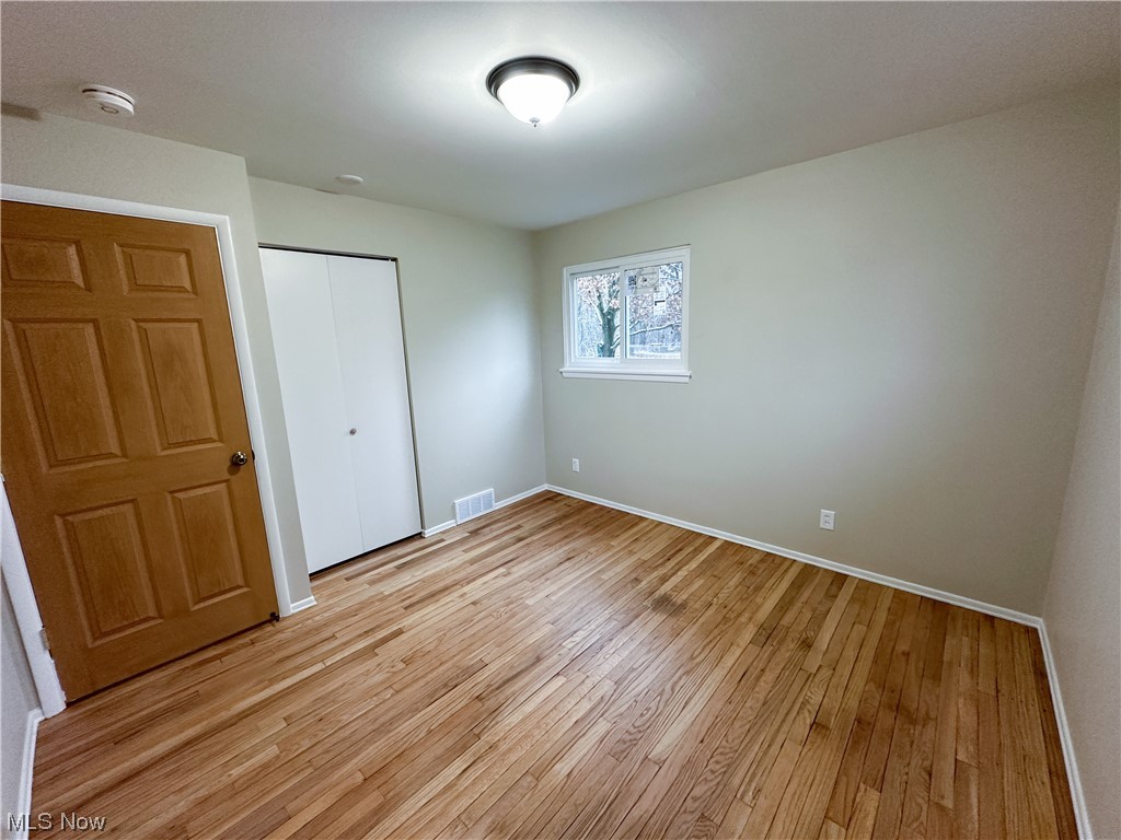 615 Liberty Road Youngstown, OH 44505 - Photo 15 of 22 Bedroom with light hardwood flooring and a closet