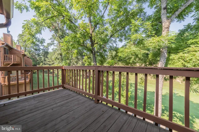 a view of wooden balcony with outdoor space