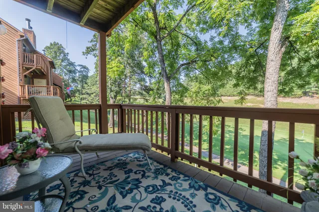 a view of a two chairs in the balcony