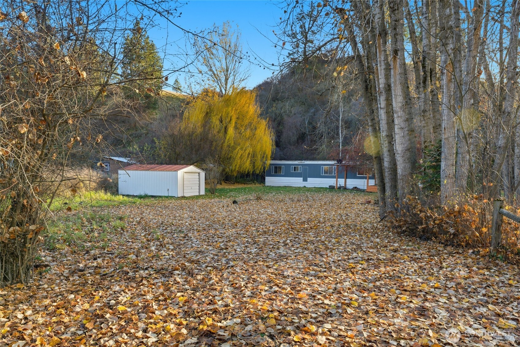 269 7 Mile Road Walla Walla, WA 99362 - Photo 29 of 40 a backyard of a house with a yard and outdoor seating