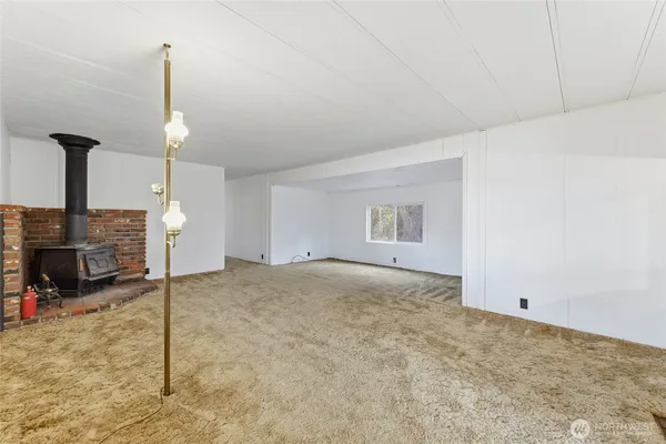 a view of a room with a fireplace