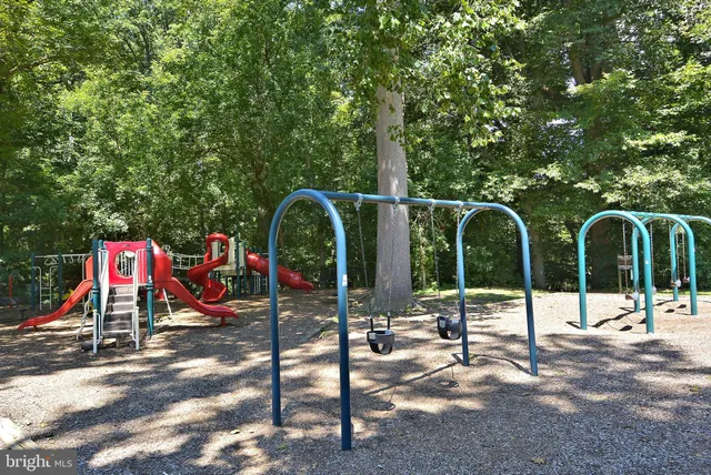a view of street with retail shops