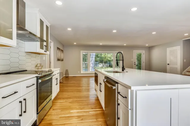 a kitchen with a stove and a sink