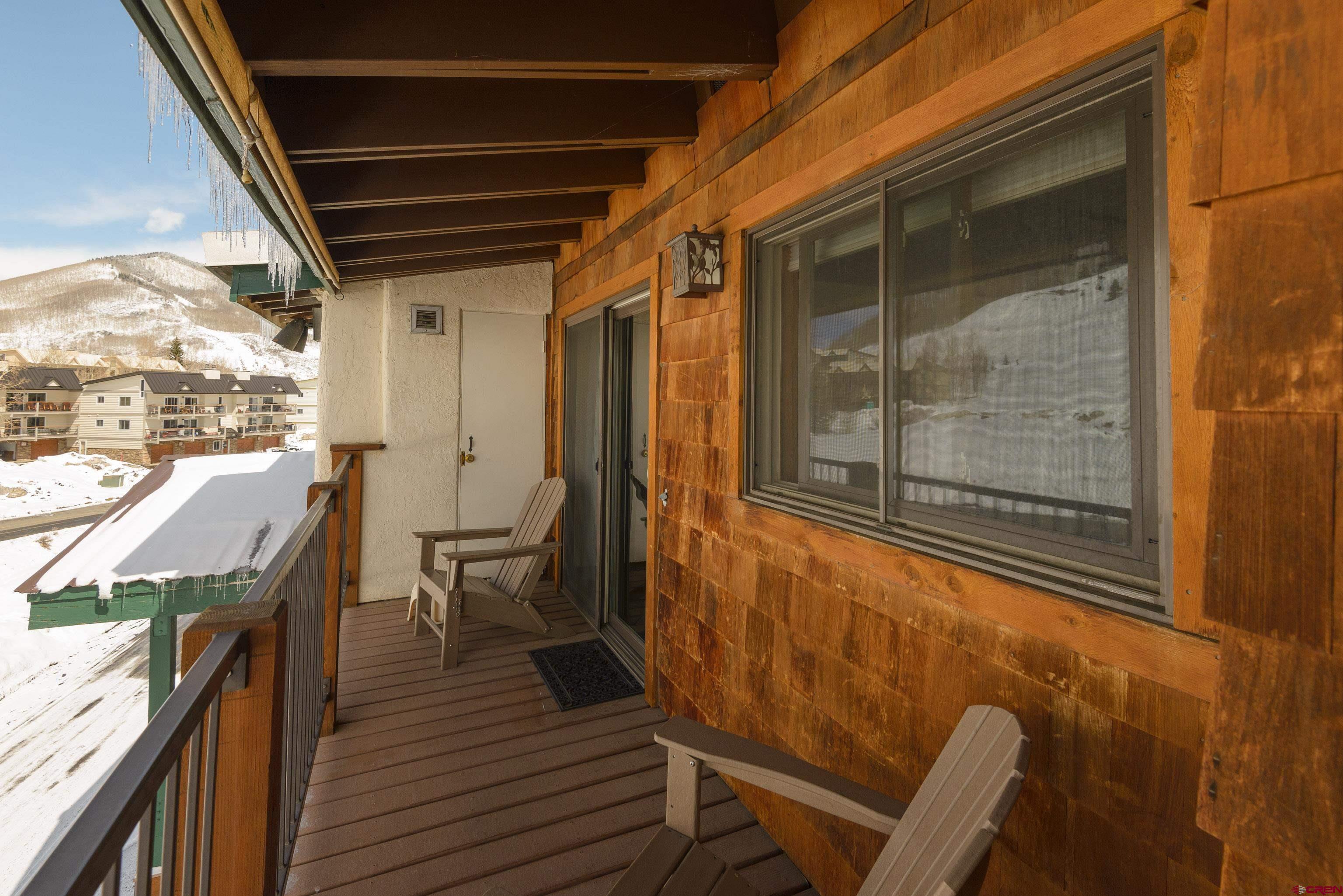 701 Gothic Road, Unit 306 Crested Butte, CO 81225 - Photo 15 of 25 a view of a balcony with chairs