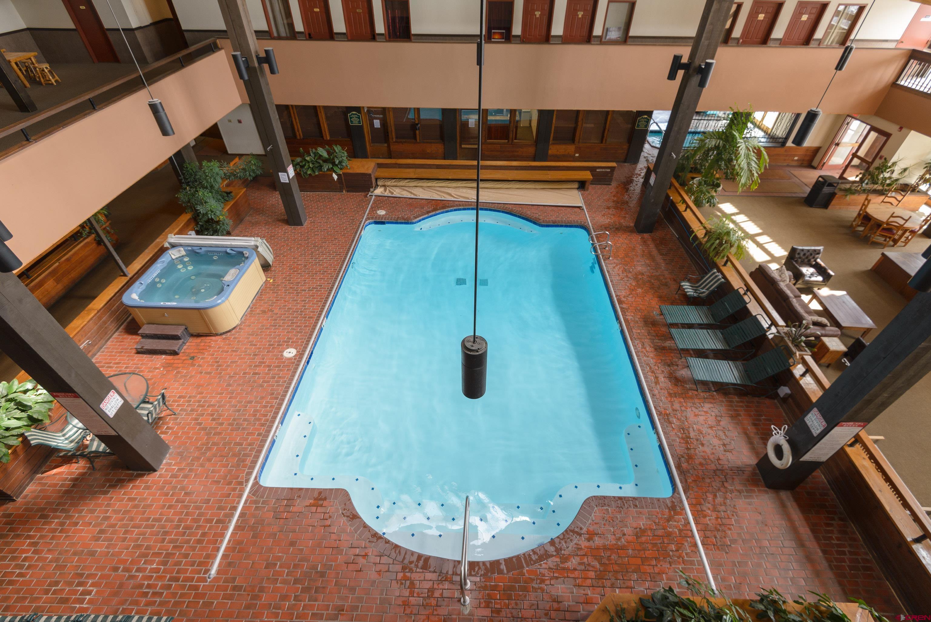 701 Gothic Road, Unit 306 Crested Butte, CO 81225 - Photo 17 of 25 a swimming pool with outdoor seating