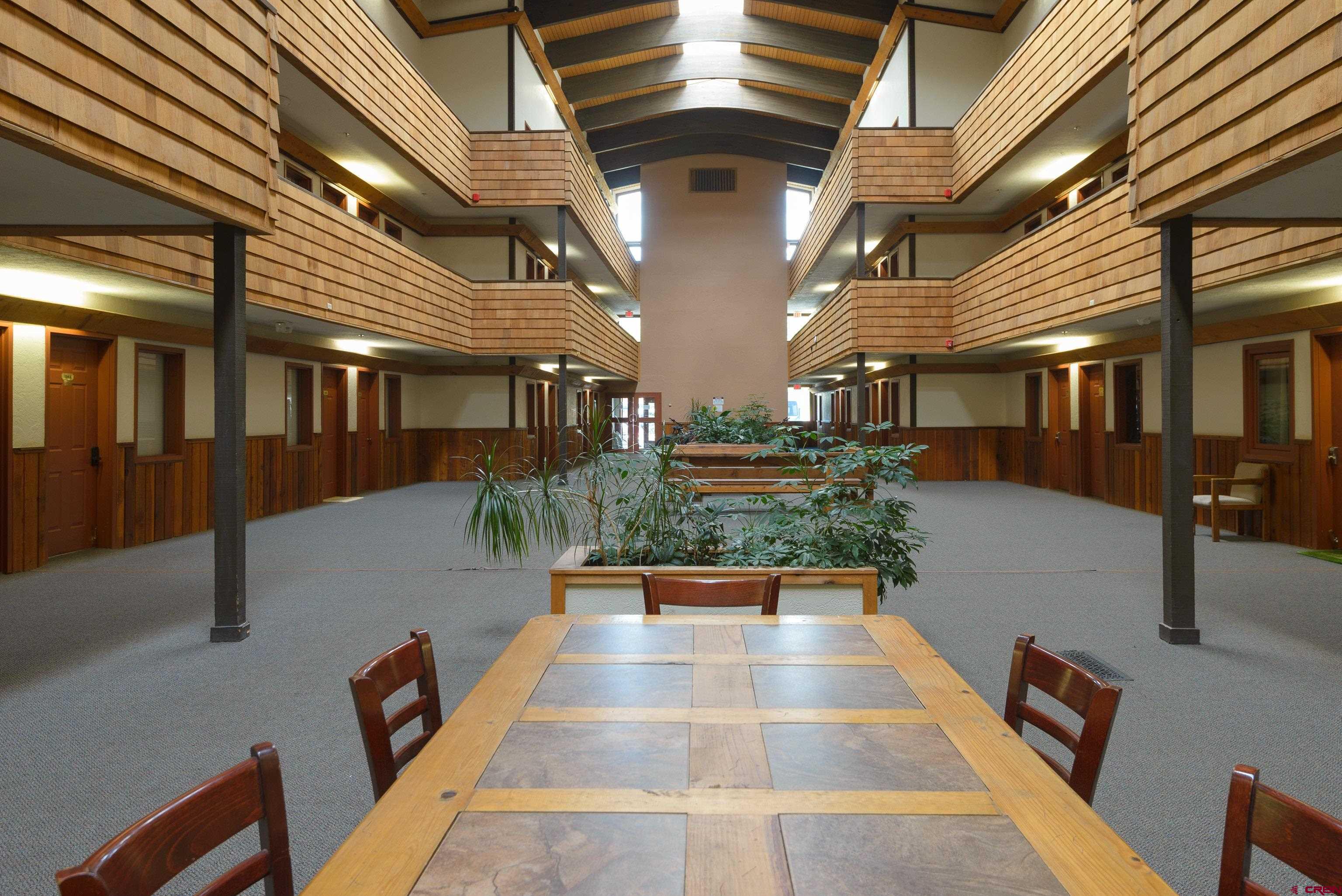701 Gothic Road, Unit 306 Crested Butte, CO 81225 - Photo 23 of 25 a lobby with furniture and a potted plant