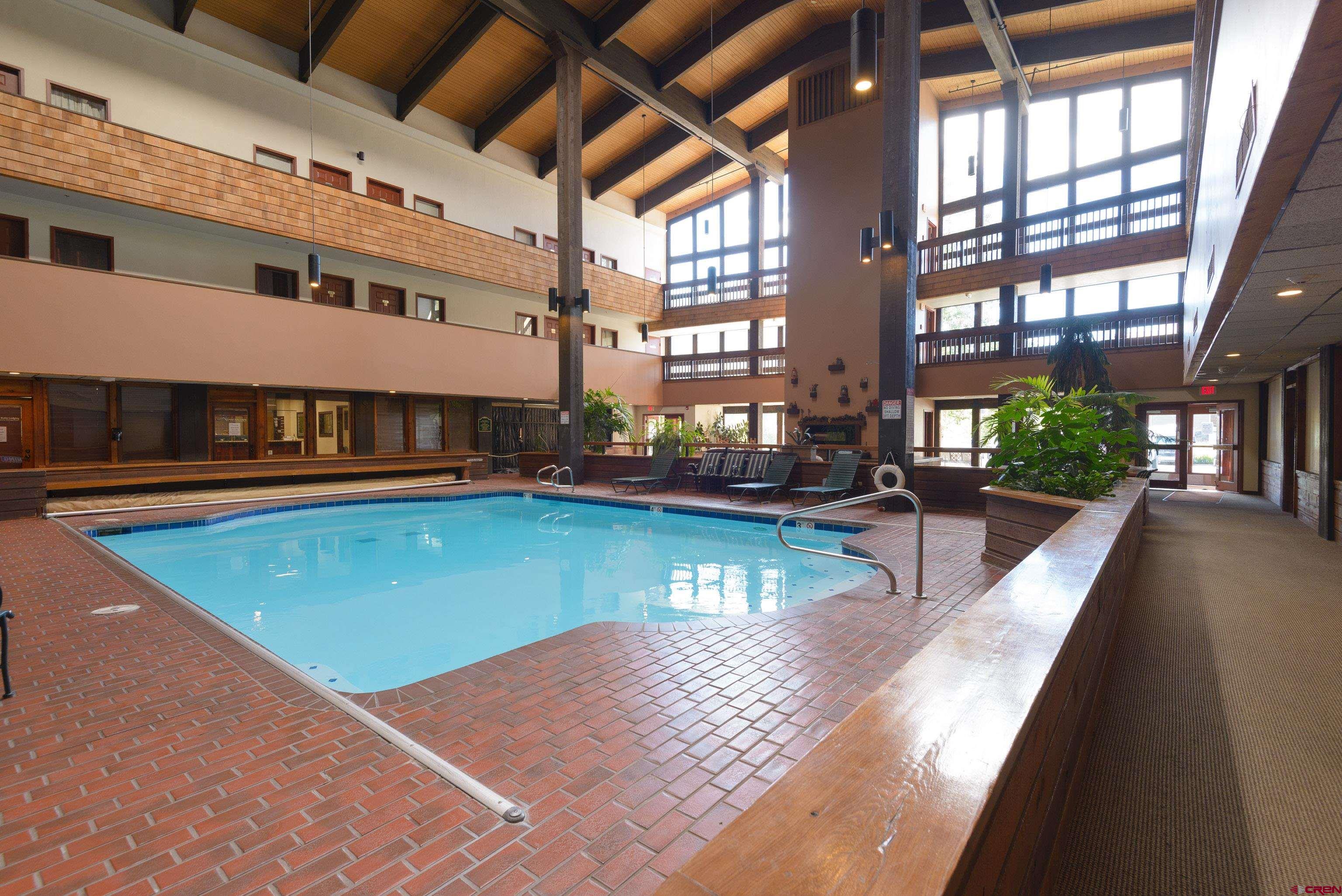 701 Gothic Road, Unit 306 Crested Butte, CO 81225 - Photo 24 of 25 a view of a swimming pool with a patio