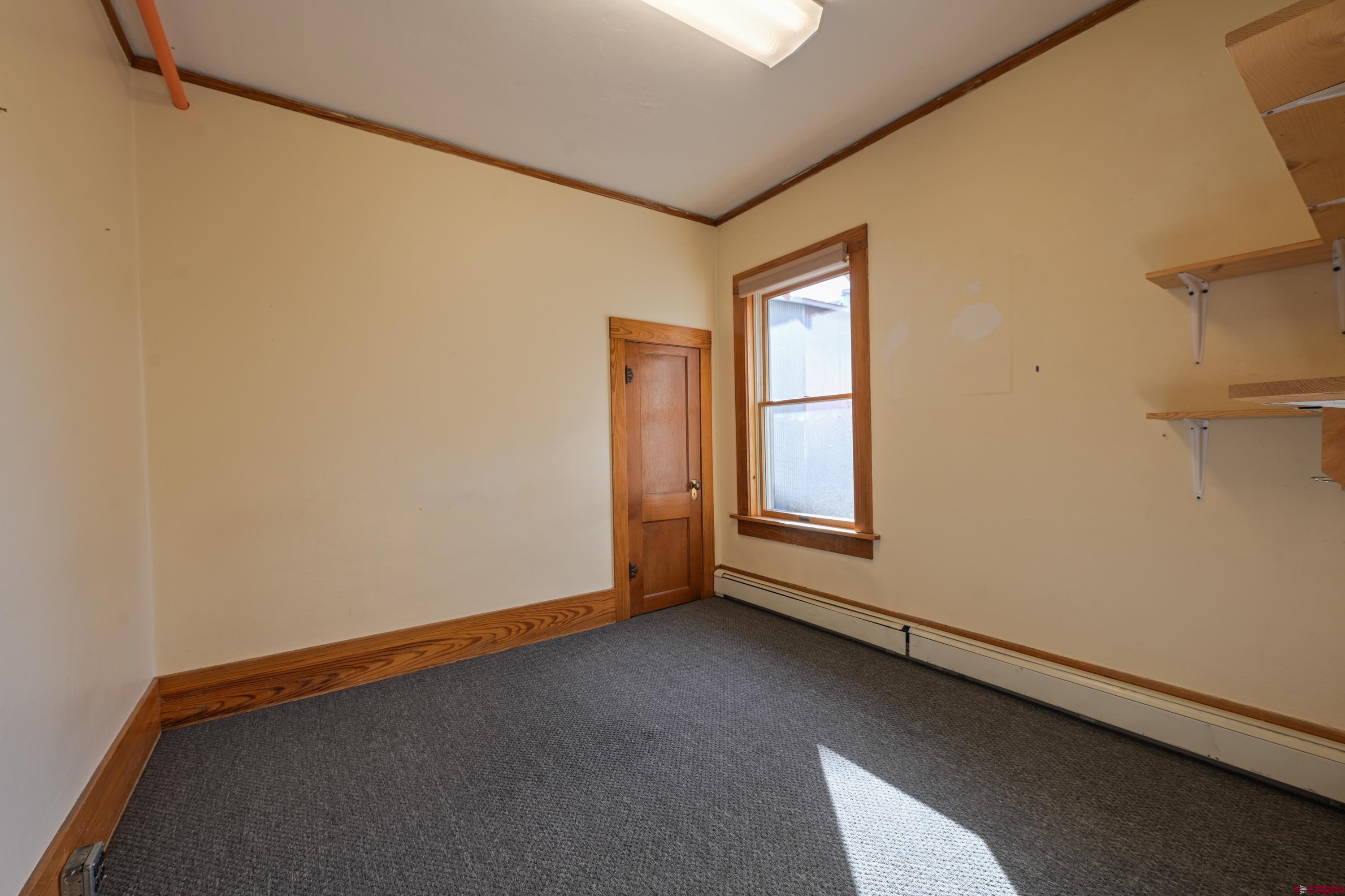 322 North Main Street Gunnison, CO 81230 - Photo 12 of 44 a view of an empty room with a window