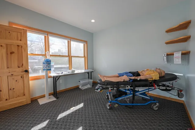 a dining room with a table and chairs