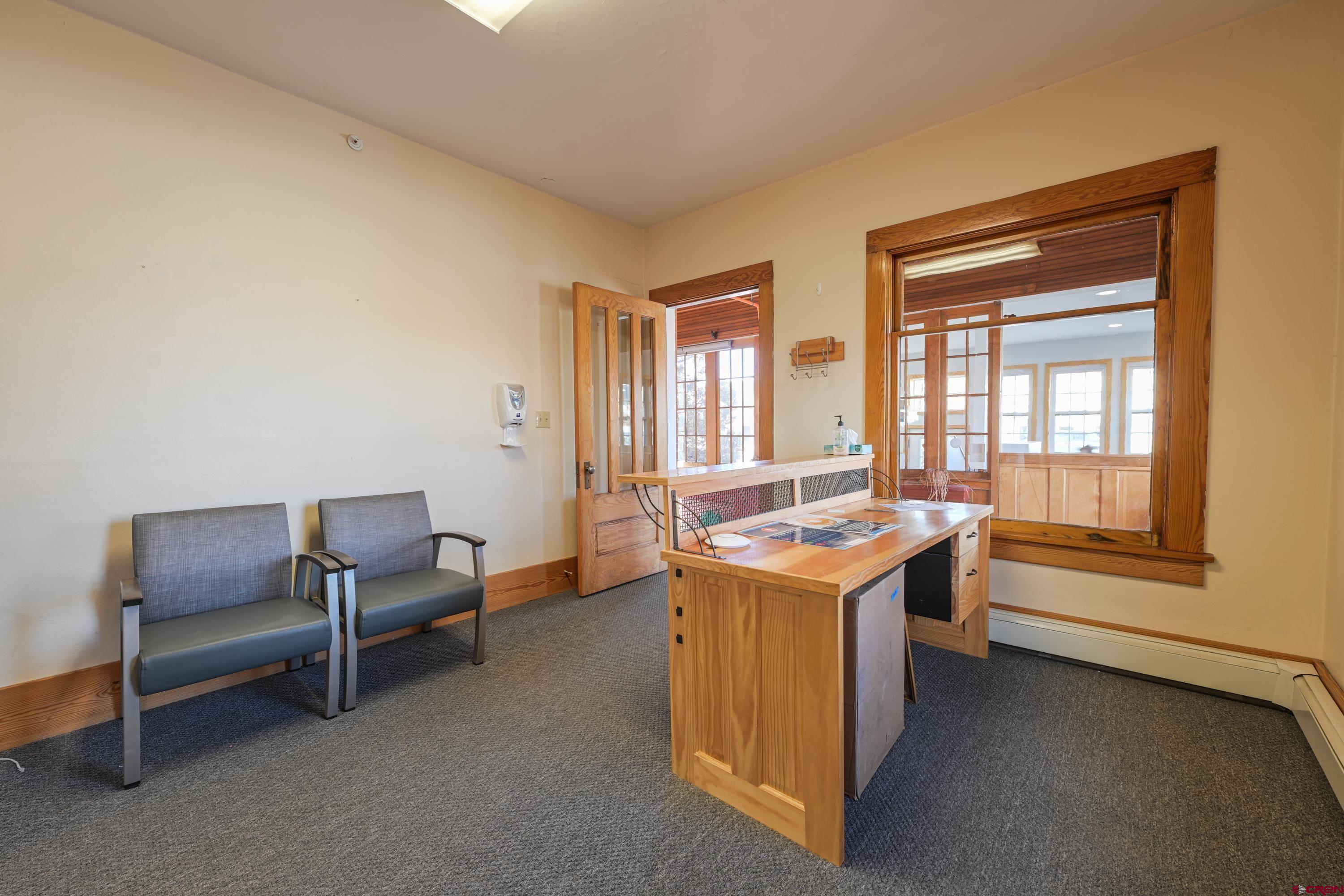 322 North Main Street Gunnison, CO 81230 - Photo 19 of 44 a view of a room that has a couch and a table in it