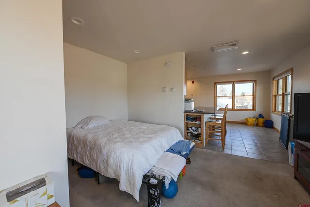 a bed room with a bed and furniture