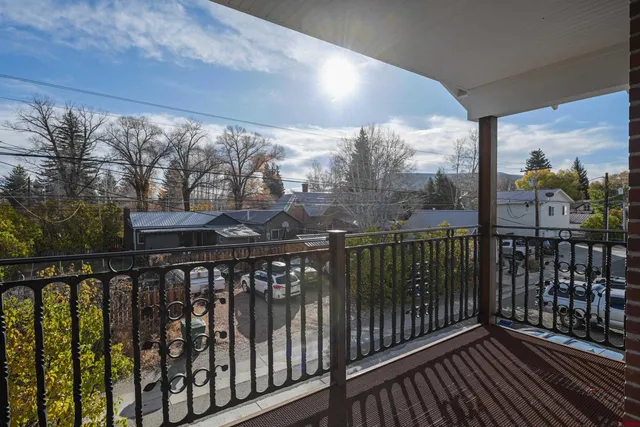 a view of a street from a balcony