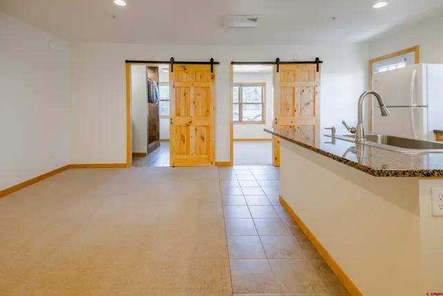 a view of a living room with a large window