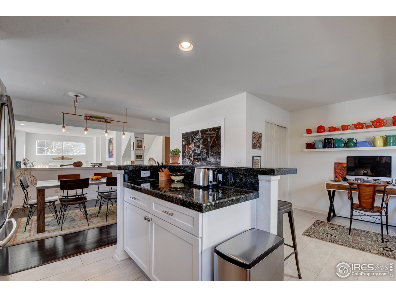 4222 Riley Drive Longmont, CO 80503 - Photo 16 of 40 Kitchen opens to dining and study nook.