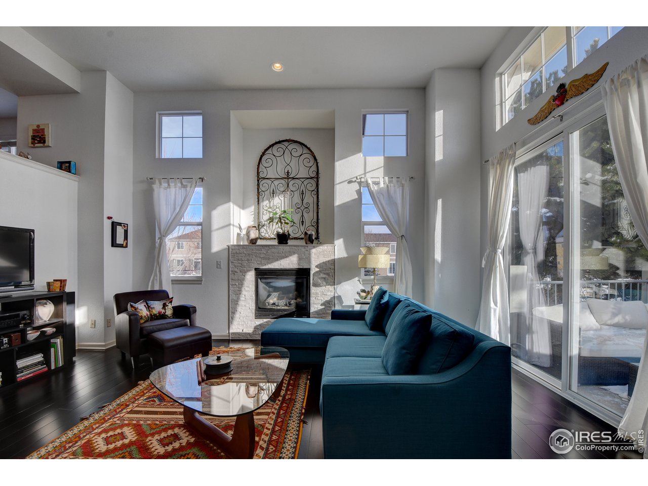 4222 Riley Drive Longmont, CO 80503 - Photo 5 of 40 Gas fireplace and sliding doors open to patio.