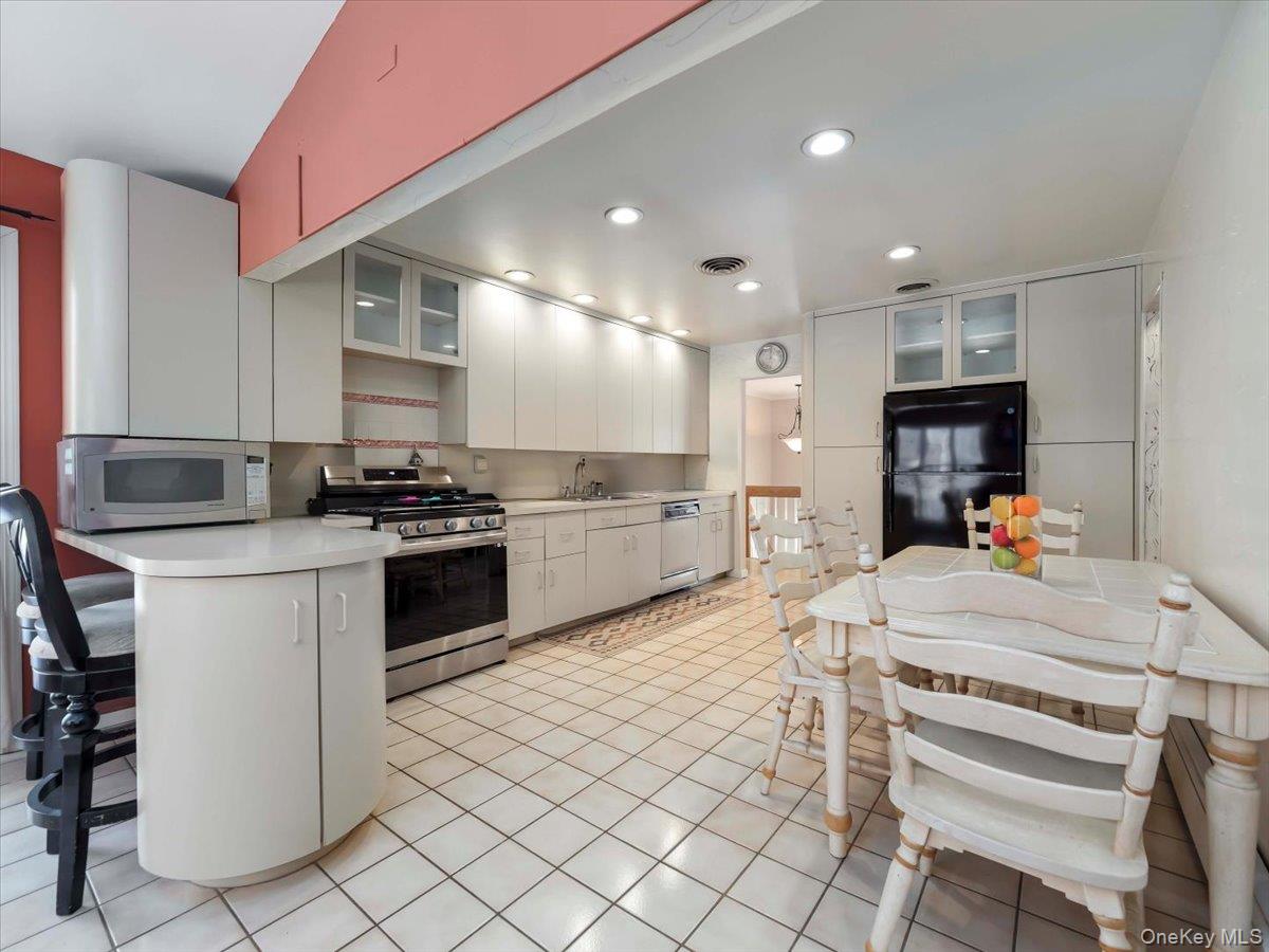 13 Razel Avenue Spring Valley, NY 10977 - Photo 12 of 43 a kitchen with a sink cabinets and stainless steel appliances