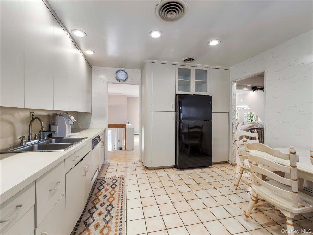 13 Razel Avenue Spring Valley, NY 10977 - Photo 13 of 43 a kitchen with a sink and refrigerator