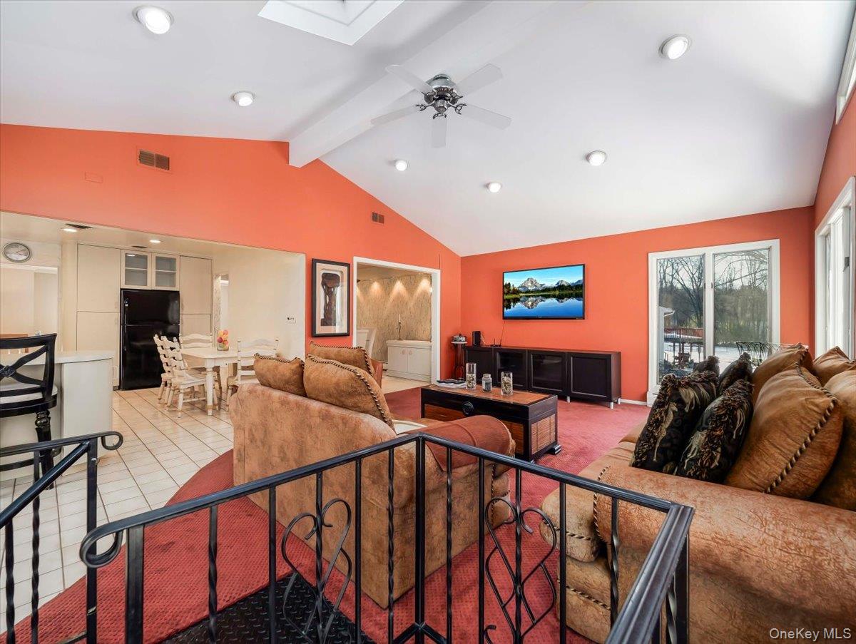 13 Razel Avenue Spring Valley, NY 10977 - Photo 19 of 43 a living room with furniture a flat screen tv and a large window