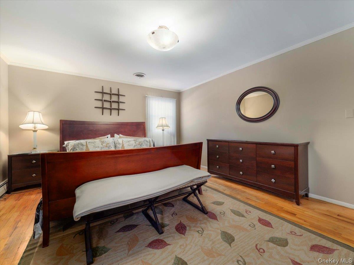 13 Razel Avenue Spring Valley, NY 10977 - Photo 21 of 43 a living room with a couch and a wooden floor