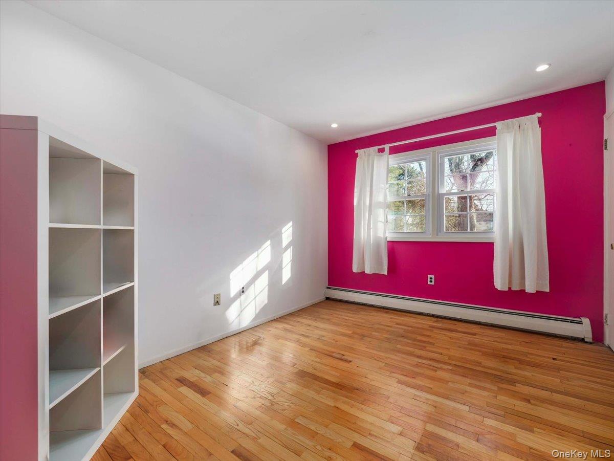 13 Razel Avenue Spring Valley, NY 10977 - Photo 26 of 43 a view of empty room with wooden floor and fan