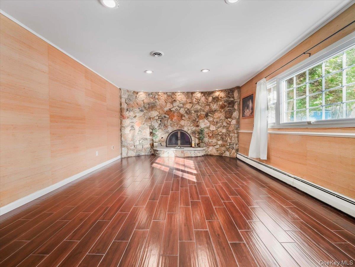13 Razel Avenue Spring Valley, NY 10977 - Photo 29 of 43 a view of empty room with wooden floor and fan