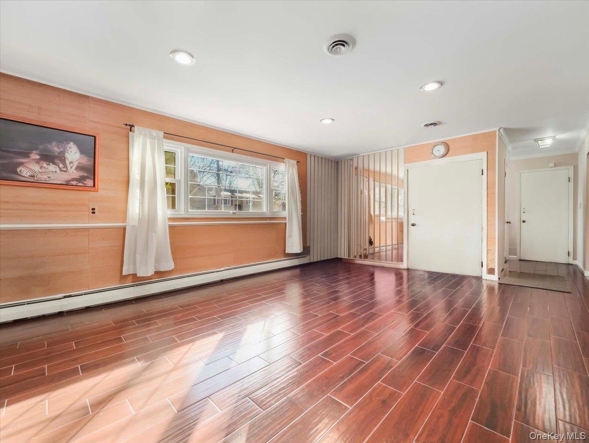 13 Razel Avenue Spring Valley, NY 10977 - Photo 32 of 43 a view of empty room with wooden floor and window