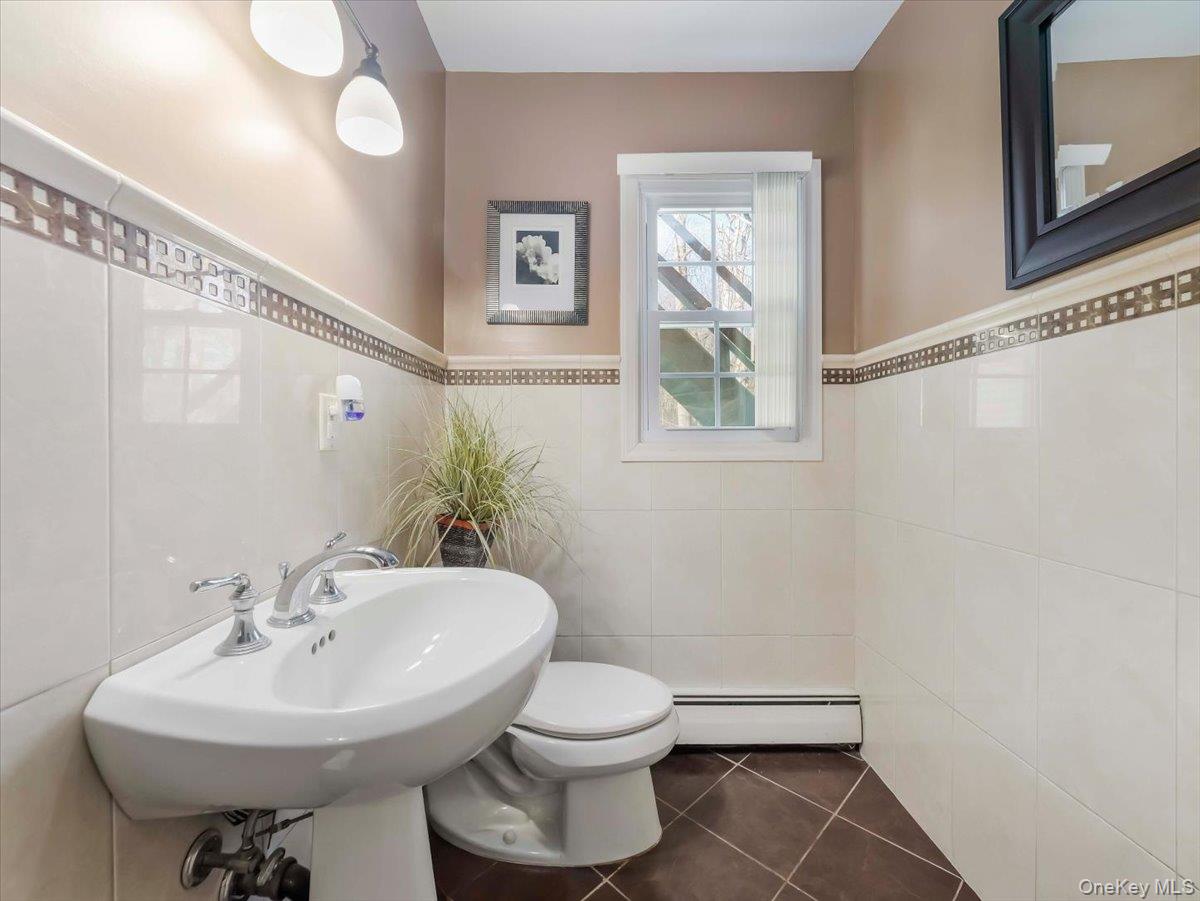 13 Razel Avenue Spring Valley, NY 10977 - Photo 36 of 43 a bathroom with a sink toilet and a mirror