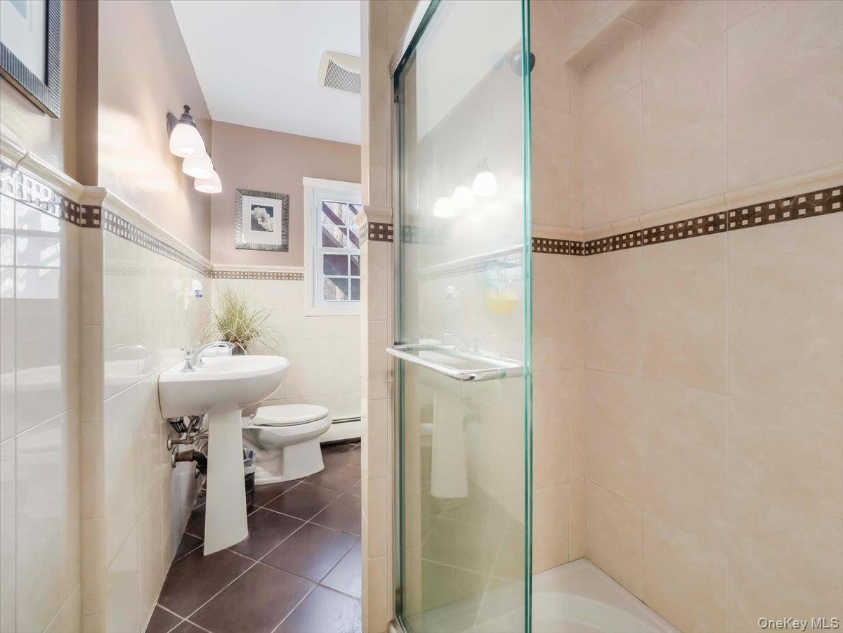 13 Razel Avenue Spring Valley, NY 10977 - Photo 37 of 43 a bathroom with a sink toilet and shower