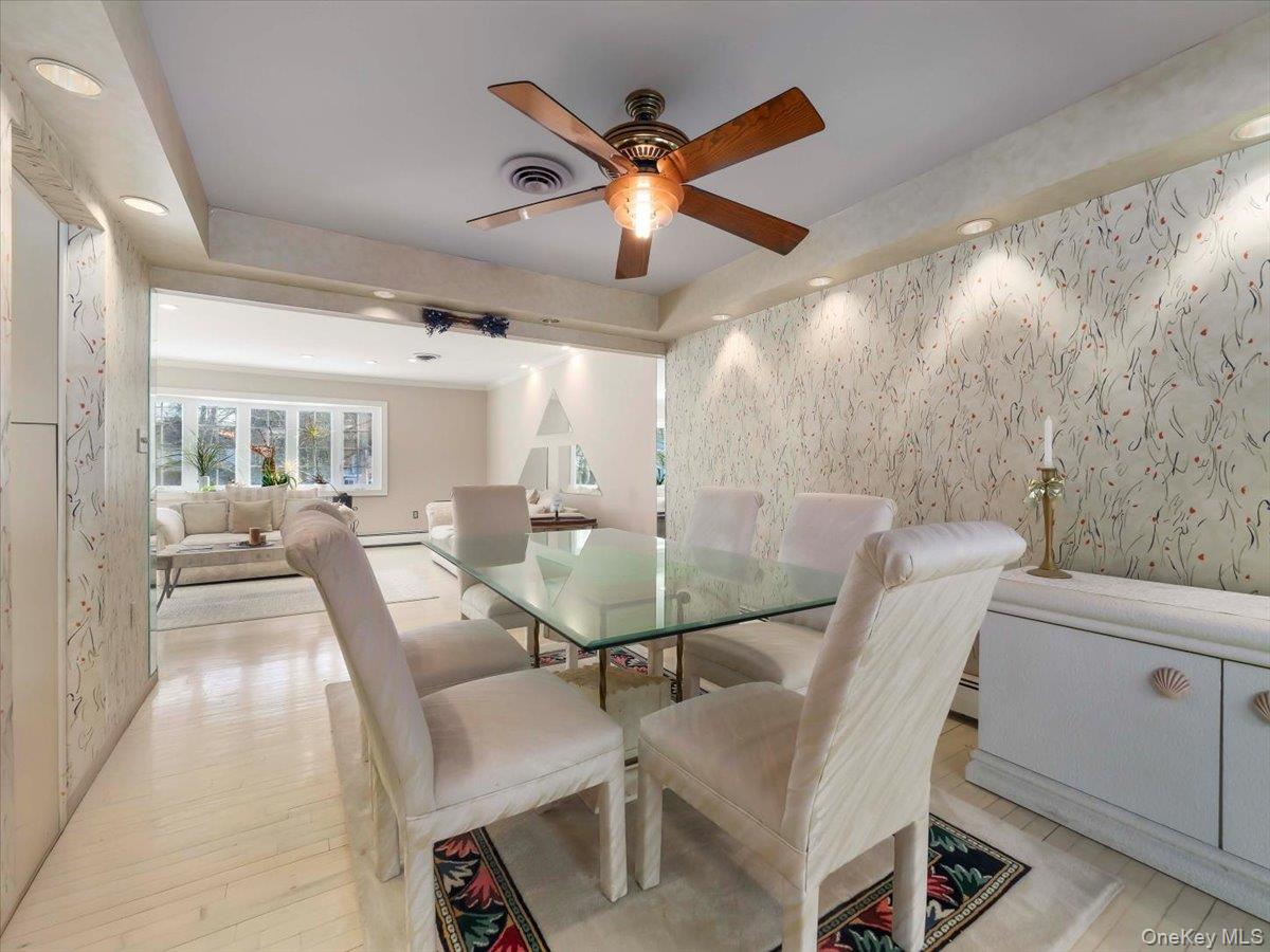 13 Razel Avenue Spring Valley, NY 10977 - Photo 10 of 43 a dining room with furniture and a chandelier fan