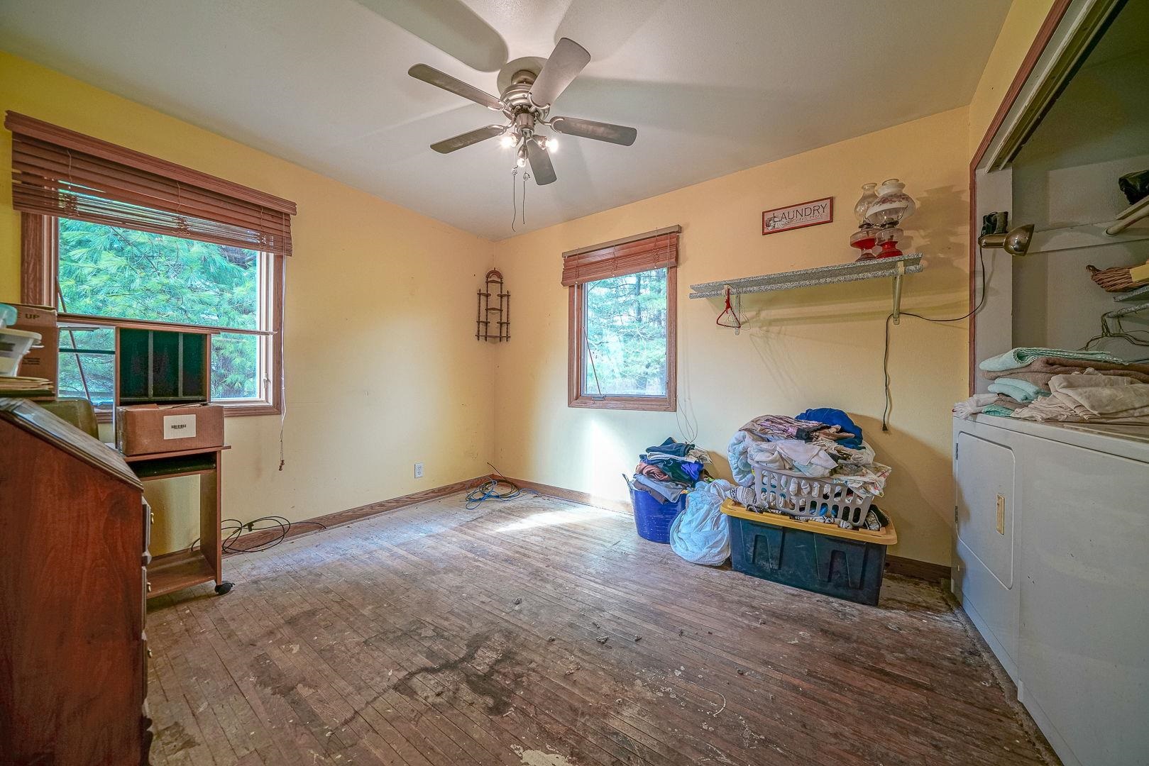 8330 North Kishwaukee Road Stillman Valley, IL 61084 - Photo 17 of 37 a living room with furniture and a window