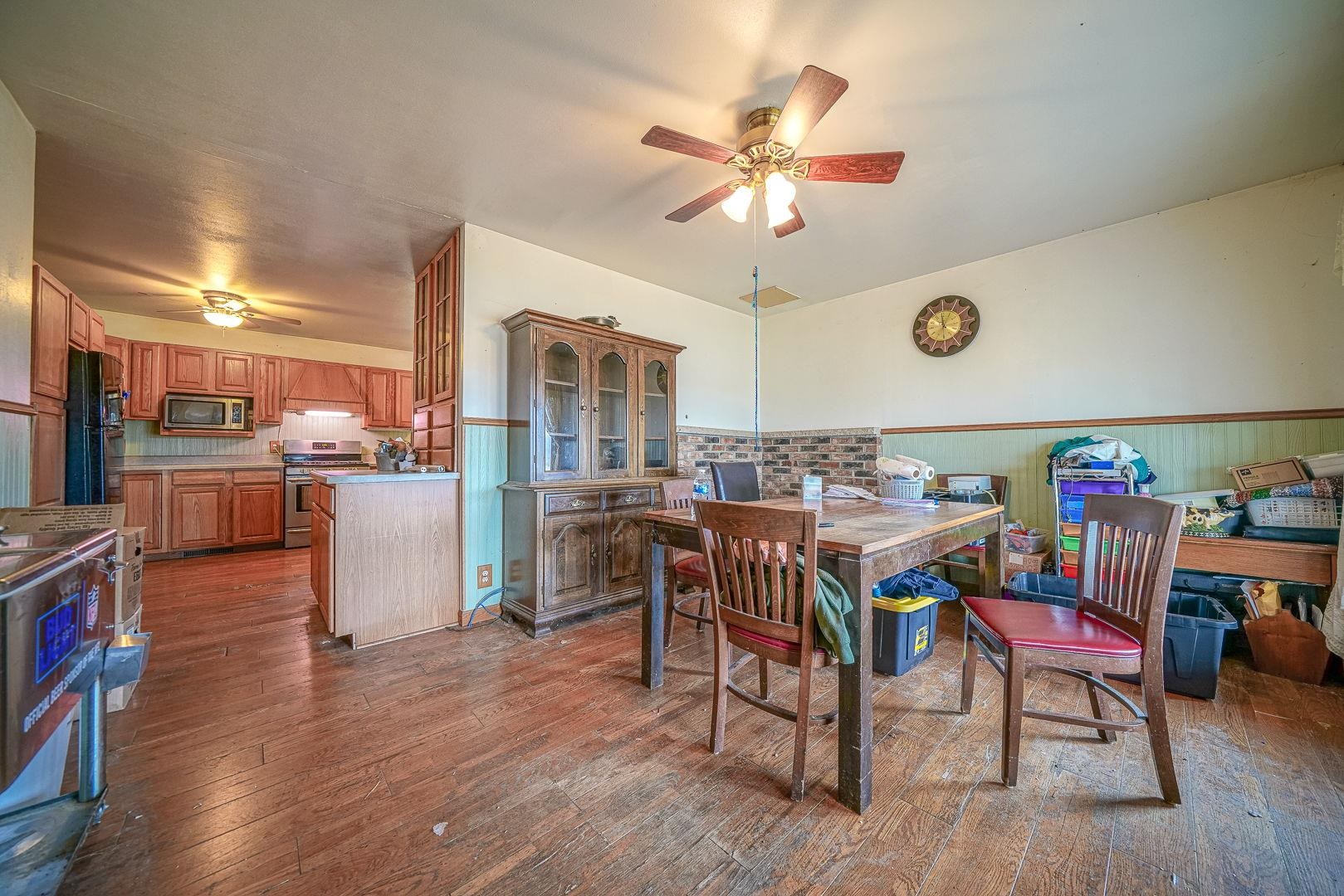 8330 North Kishwaukee Road Stillman Valley, IL 61084 - Photo 2 of 37 a view of a dining room with furniture and wooden floor