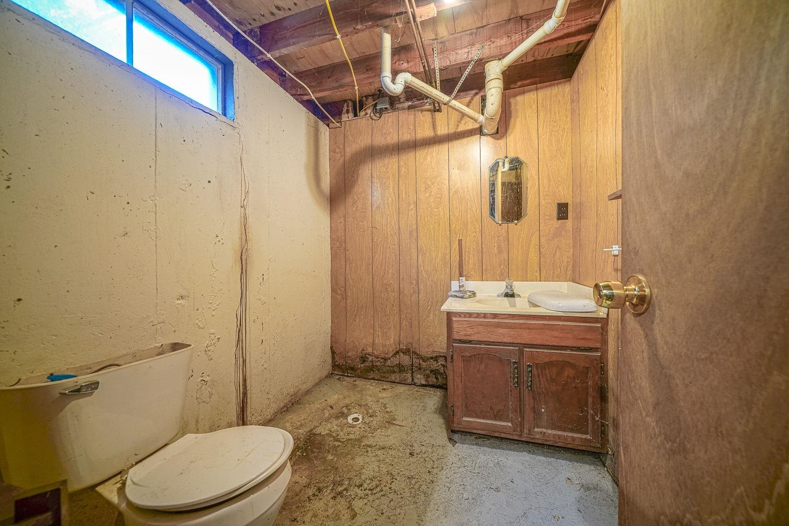 8330 North Kishwaukee Road Stillman Valley, IL 61084 - Photo 23 of 37 a bathroom with a sink a toilet and shower