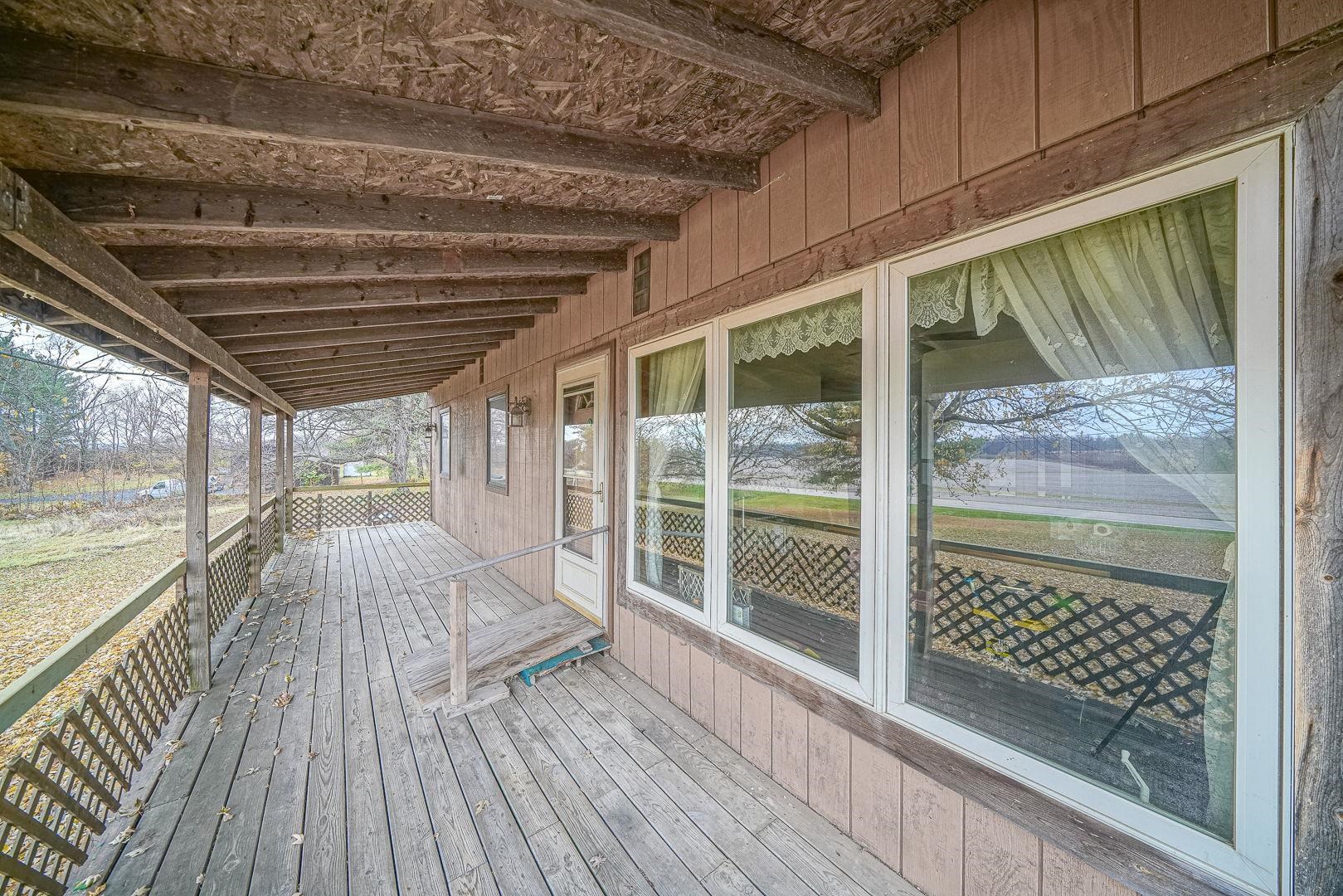 8330 North Kishwaukee Road Stillman Valley, IL 61084 - Photo 25 of 37 a view of outdoor space with wooden floor