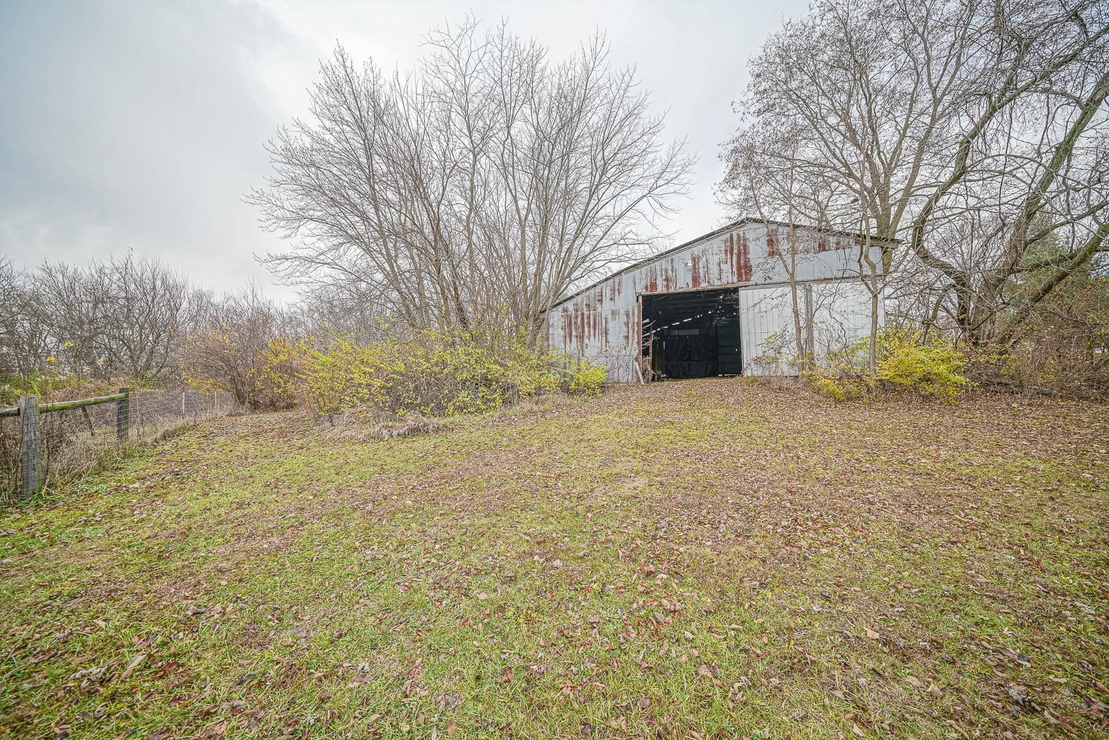8330 North Kishwaukee Road Stillman Valley, IL 61084 - Photo 27 of 37 a view of a yard with a tree
