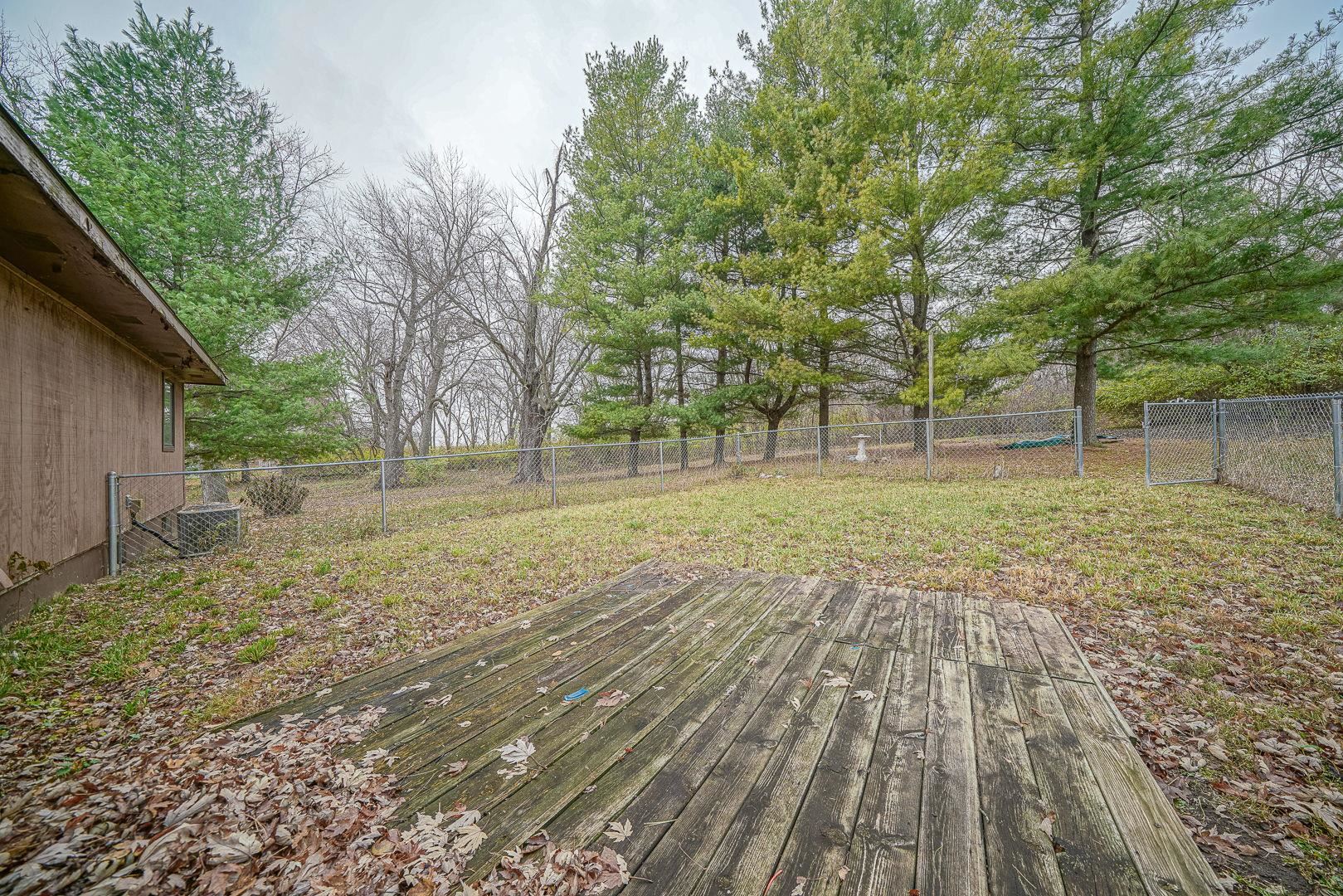 8330 North Kishwaukee Road Stillman Valley, IL 61084 - Photo 28 of 37 a view of a yard with trees