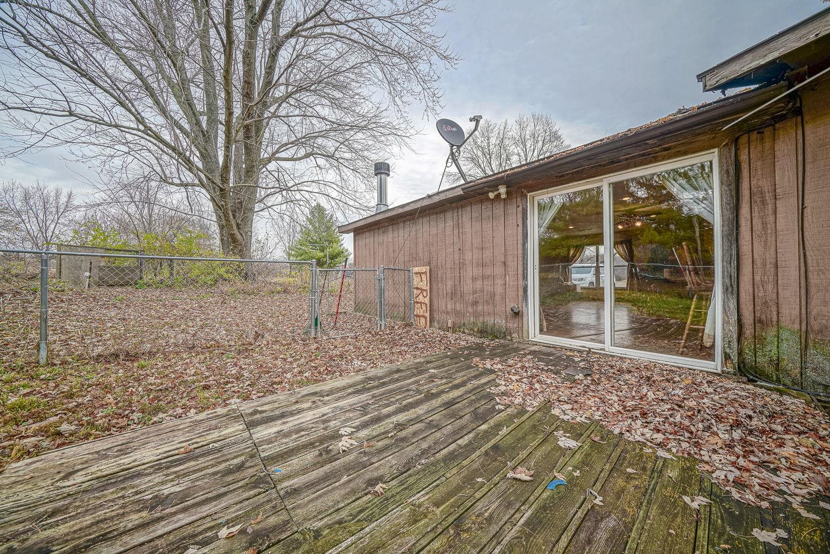 8330 North Kishwaukee Road Stillman Valley, IL 61084 - Photo 29 of 37 a front view of a house with garden
