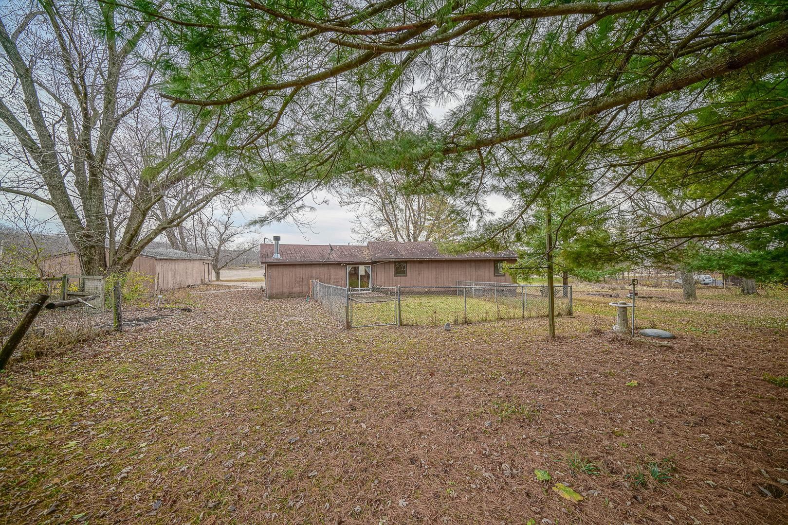 8330 North Kishwaukee Road Stillman Valley, IL 61084 - Photo 30 of 37 a view of a house with a yard